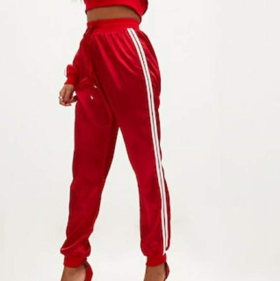 red joggers with white stripe